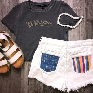 White PacSun shorts w/ painted back pockets